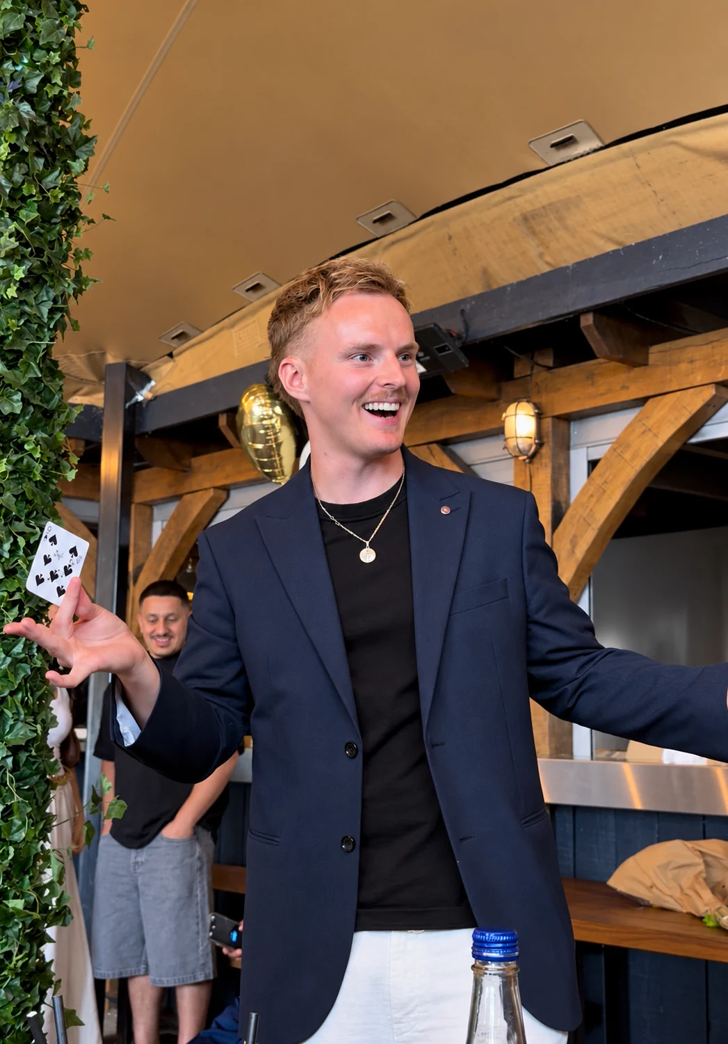 Ben performing card magic at a private party